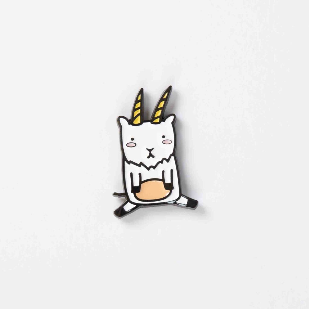 Goat enamel pin on white